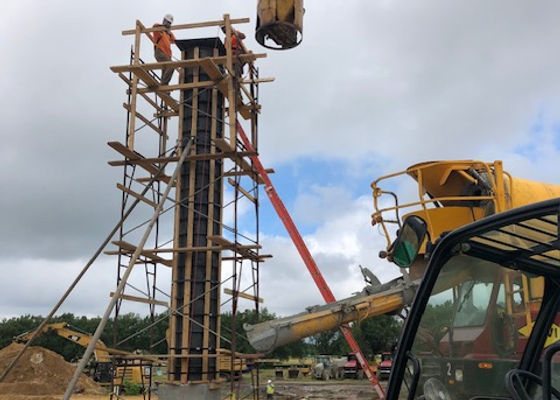 Scaffolding around formwork for a tall concrete column